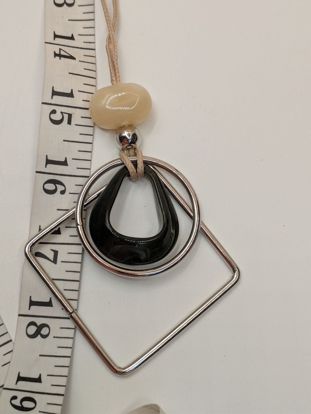 Beige and Black Modern Pendant Necklace On String - Picture 4 of 4
